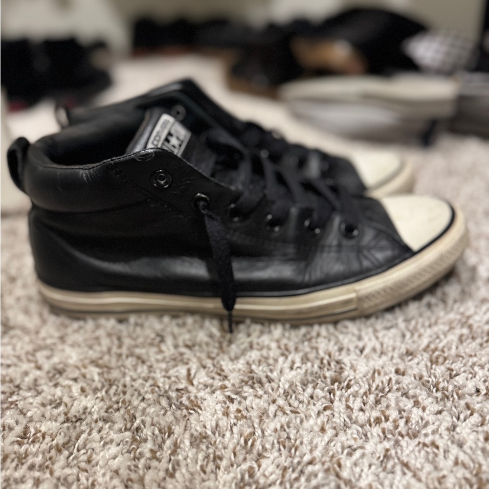Size 10, leather Chuck Taylor’s. Converse